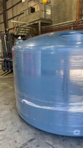 5,000L Squat Tank getting wrapped! Tankworld. Australian Owned & Made since 1972 🇦🇺 Shop now @ tankworld.com.au 🛒 Call us on 1800 68 69 70 📲 #tankworld #watertanks #rainwaterharvest | Tankworld