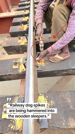 "Railway dog spikes are being hammered into the wooden sleepers." #train #railtrack #railway #wooden