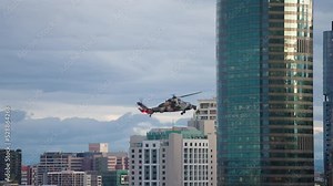 ARH Military Helicopter Waving Turret Near High Rise Building In Brisbane CBD During Riverfire, Slow Motion 4K