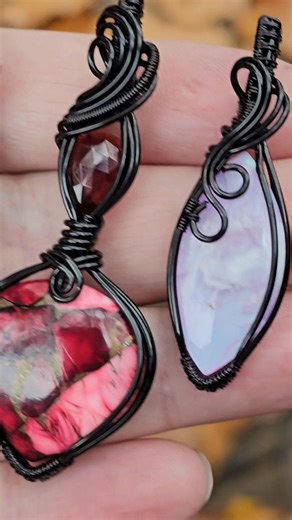 You asked, here they are! More Black wire pendants. Available next Wednesday 11/26 at 5pm PST (8pm EST) on my Facebook page Heartstone Jewelry The Pink/ Purple/ blue ones are Plume Agate Doublet stones and the red pendant is a Red Rose Dahlia and Garnet pendant. All really cool stones. | Heartstone Jewelry