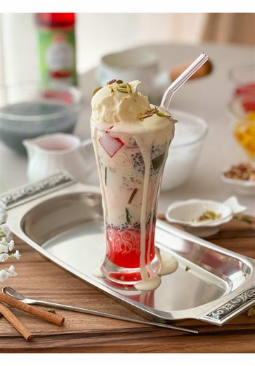 Falooda 🍧(Summer Special Dessert) This cold and creamy Falooda dessert will bring a wave of refreshment to your day! Layers of vermicelli, vanilla ice cream, and Rabri meld together beautifully, creating this delightful dessert💗 •Falooda Vermicelli •Rabri Milk •Rose Syrup / Rooh Afza •Vanilla Ice cream •Jelly (different colors) •Basil seeds •Nuts (sliced pistachios & Almonds) 📌For the full recipe please head obver to my YouTube Channel or click the link in bio) _____ 🌸Follow @mariumsfoodchan