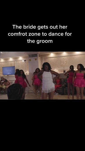 Bride Dances for Groom with Bridesmaids During Wedding Reception