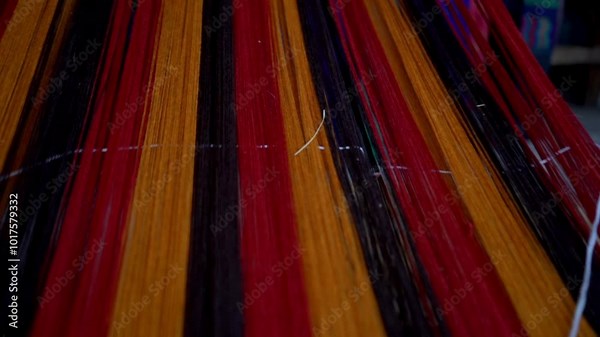 A variety of colorful threads arranged to weave a typical costume. These threads of different textures and bright colors are part of the artisanal process used in the creation of clothing.