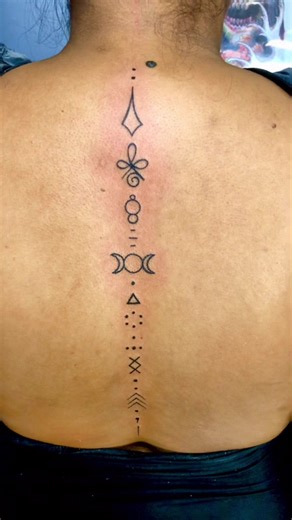 Innovative Semi-Colium Back Spinal Tattoo Design