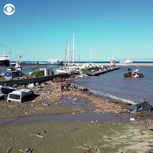 Drone footage shows the aftermath of a deadly storm-driven landslide on Italy's Ischia island. Rescue teams are continuing to search mud and debris for those still missing. | CBS News