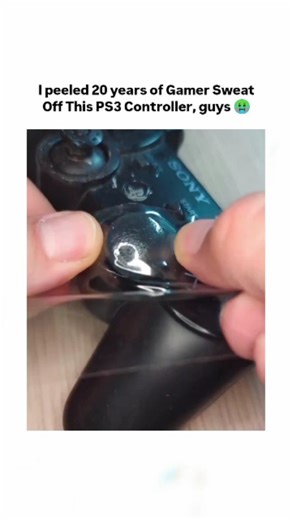 TrueReel on Instagram: "The video depicts a hands-on restoration of a DualShock 3 controller, peeling away a sticky, translucent layer from grips and buttons to expose underlying plastic, exaggerated as "20 years of gamer sweat" for comedic effect. - This buildup stems from rubber degradation in Sony controllers, where plasticizers leach out over time, reacting with skin oils to form a tacky residue—a common complaint since the PS3's 2006 launch, as noted in repair forums and YouTube guides. - W