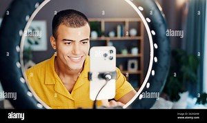 Man, influencer and smile with ring light in home for live streaming, video or post on social network. Person, selfie and happy with broadcast for Stock Photo - Alamy