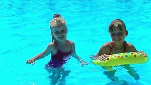 Children Sitting On Inflatable Ring Swimming Stock Footage Video (100% Royalty-free) 6322397 | Shutterstock