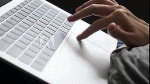 Using laptop computer with one hand and fingers for relaxation 4K footage