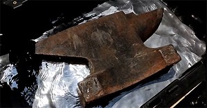 Why does iron sink in water but float when dropped in mercury?