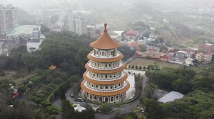 Circle around the temple to the tip of the temple view - Experiencing the Taiwanese culture of the spectacular five-stories pagoda tiered tower Tiantan at Wuji Tianyuan Temple at Tamsui District | Premium Stock Video Footage