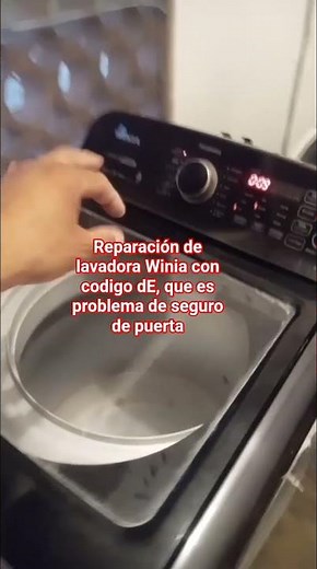 tu lavadora Winia presenta el código dE quiere decir que que tu seguro de puerta está dañado