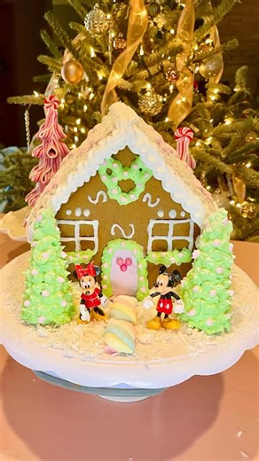 ✨🏰 Transform your gingerbread house into a magical Disney Christmas cottage! 🍭✨ Watch as we take a simple pre-assembled gingerbread house and sprinkle it with Mickey & Minnie magic, pastel colors, and holiday cheer. Perfect for Disney-inspired Christmas décor or a fun holiday baking project! To make this DIY Disney gingerbread house, we used: 🍭 Pre-made gingerbread house 🍬 Royal icing in white, pink & green 🍭 Small pink ball candies 🍬 2 ice cream cones 🍭 Shredded coconut 🍬 Pastel marshma