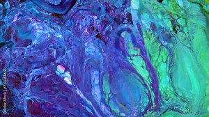 This stock video features a slow motion footage of oil paint motion, where Paint pigment are separated by light paint. Use this clip as background for creative concept videos, presentations, and more.
