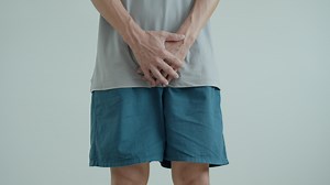 Download Man hold hand in front of private parts feeling discomfort from disease and inflammation. Venereal, testicular cancer. bladder problems, erectile dysfunction, premature ejaculation, prostate cancer for free