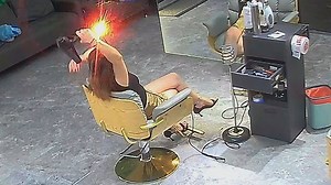 Woman's hair drying session interrupted by an explosion