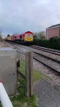 class 66 db cargo slowly makes its way along the track