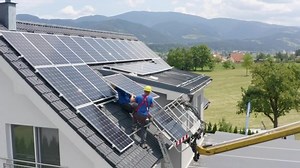 clip-1073454953-solar-panels-installed-on-roof-residential-house