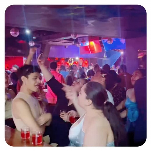 Vibrant Nightclub Scene: Dancing and Socializing Fun