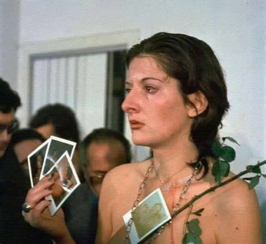 In 1974, Serbian performance artist Marina Abramovic performed "Rhythm 0" at Studio Morra in Naples, Italy. For six hours, from 8PM to 2AM, she stood completely still while the audience was invited to do whatever they wanted to her using any of 72 objects she had placed on a table. The items ranged from objects of pleasure, like a rose, feather, perfume, honey, and grapes, to objects of pain and danger, including scissors, a scalpel, nails, a metal bar, a loaded gun, and a single bullet. The per