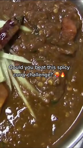 Adam Richman Tackles the Spiciest Curry Challenge in NYC!
