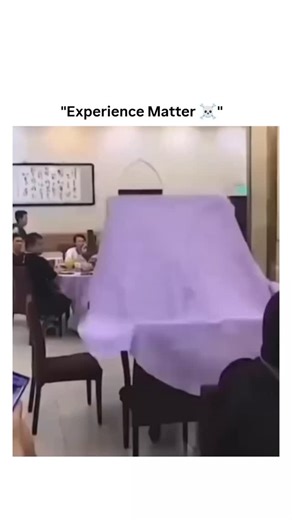sci tech | historygg on Instagram: "This video captures an impressive display of skill and efficiency by a waiter in a bustling restaurant. The scene centers on his ingenious method for setting a large, round banquet table. Instead of walking around the table to manually spread the purple tablecloth, he leverages physics and the table's "Lazy Susan" to do the work for him. With a practiced motion, he spins the central turntable rapidly. As it gains momentum, he tosses the folded cloth onto it. T