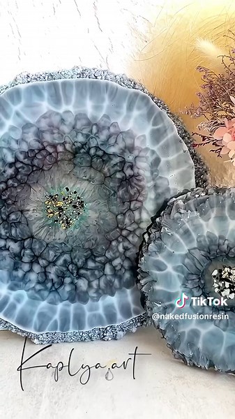 Behold the beauty of nature captured in resin with @kaplya.art's stunning coral blue geode resin coasters! Their meticulous attention to detail and creative flair bring to life coasters that resemble exquisite gemstones, adding a touch of luxury to any tabletop. 💙💫 Originally made by @kaplya.art Ready to make a statement in your decor? Trust @nakedfusionresin for unmatched quality and elegance! 💎 #ResinCoasters #GeodeCoasters #CoralBlue #ResinArt #ResinCraft #ResinDesign #ResinCreation #Resin