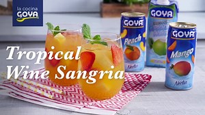 Try our Tropical Wine Sangria—the drink you’ll want to come back to all summer long. 🍹 | Goya Foods