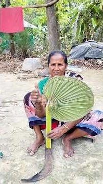 Making a hand fan from palm leaves." #shortsvideo