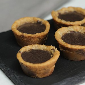 Peanut Butter Oreo Chocolate Chip Cups Full recipe: https://taste.md/2ea68Wt | Tastemade