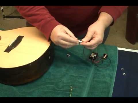 Installing an end pin jack in an acoustic guitar