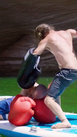 Boxing on a floating board at sea