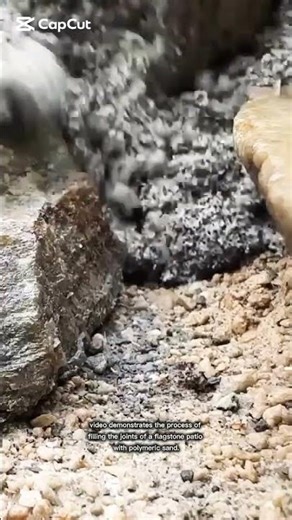 process of filling the joints of a flagstone patio with polymeric sand.