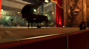 Old opera house interior featuring a grand piano and theatrical lighting