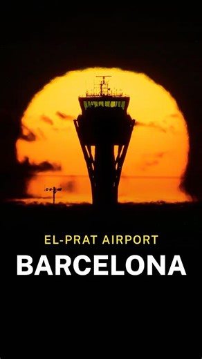 Sunrise behind the control tower of Barcelona