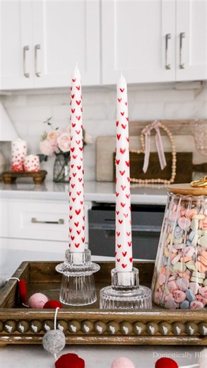 Giustina | DIYs • Recipes • Home Inspiration on Instagram: "Follow & comment “Link” to instantly get the links, tutorial, & details in your DM. These DIY Painted Heart Candles are so easy and lots of fun to make, making them perfect for a girl’s night or Galentine’s Day party. I originally planned to make the hearts pink and red, but the pink tea lights I had looked almost white on the taper candle, so I decided to stick with just red. And I absolutely love how they turned out! They make for a b