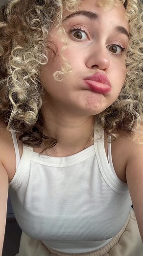 Curly Haired Dancer Showcases Unique Movement Style