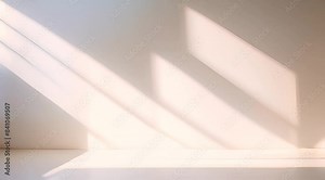 Minimalistic abstract simple gentle light beige background for product presentation with soft, elegant shadows from a window on the wall, creating a serene and calm atmosphere.