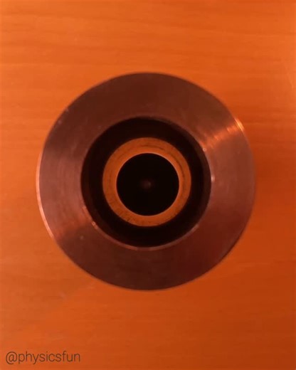 physicsfun on Instagram: "Lenz’s Law: a strong @feelflux neodymium magnet falls slowly down a thick walled copper tube as though passing through a viscous liquid. Since magnetic fields pass through copper, magneview film reveals the location of the falling dipole magnet. The moving magnetic field from the falling magnet produces electric currents in the copper- these currents then produce magnetic fields that have the opposite polarity to the initial field. So a falling magnet makes the copper p