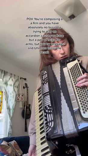 Female Accordion Player Expressing Pain Through Music