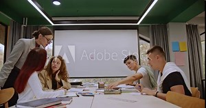 After class, students and their professor collaborate, learning new concepts together with strong communication and support from the teacher, fostering an engaging and productive learning environment.