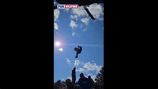 Injured hiker is hoisted to safety by helicopter