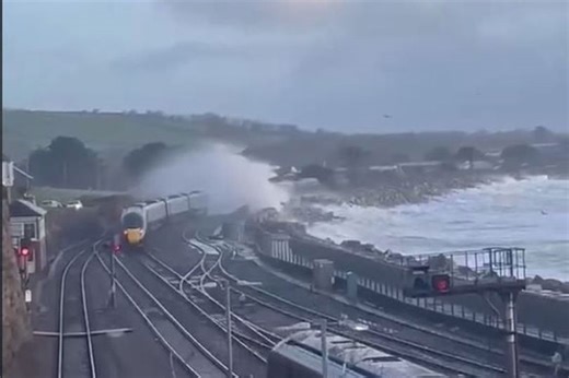 Huge waves batter Penzance coast and splash train as Storm Ingrid hits