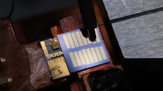 Coin-sized electro-optic comb with 450 nm precision advances photonics