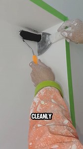 This wall painting trick uses a putty knife as a shield. | Lara Amélia