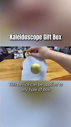 A gift box that is both playable and visually appealing, like a kaleidoscope.