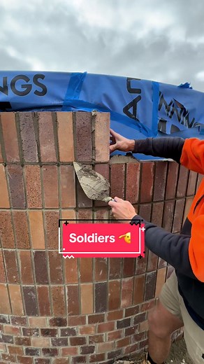 Soldiers Mastering Brick Laying Techniques