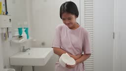Asian girls suffer from diarrhea their stomach is painful. Ache and...