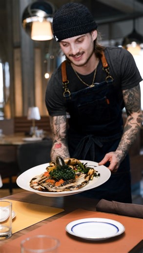 Fire-grilled whole steelhead trout, deboned and finished with caraway beurre blanc, smoked trout roe, and grilled contorno. You’ll always find Chef Matt at our wood-fired grill, expertly preparing our proteins to perfection. 🔥 | Nico Taverna