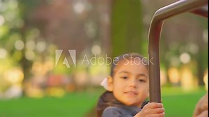Young girls playing on a merry-go-round